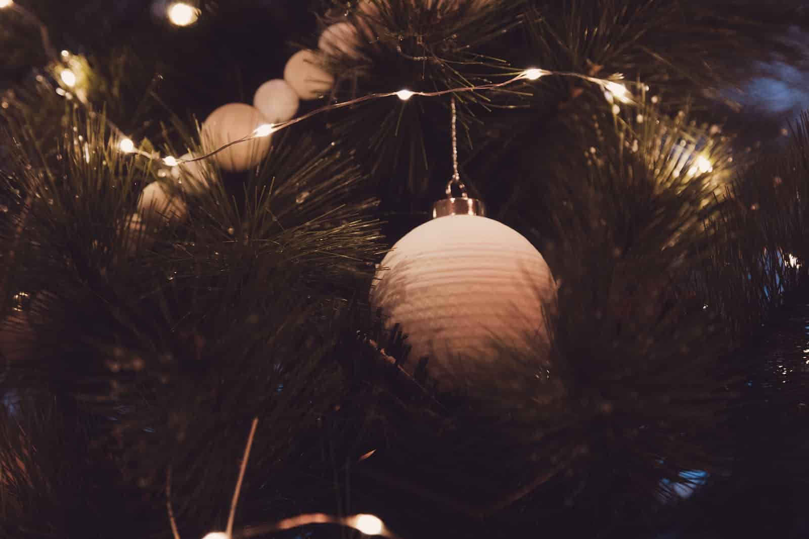 white bauble in Christmas tree